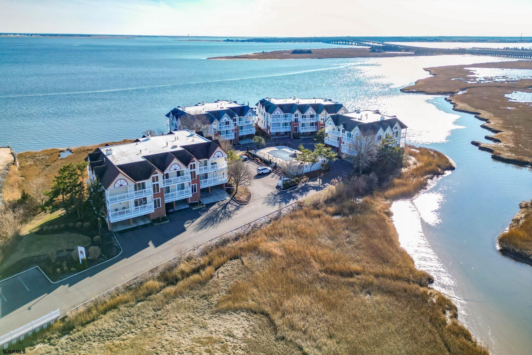 120 South Pointe, Unit 120 SOUTH POINTE DR Somers Point, NJ 08244 - Photo 1 of 41 a view of a terrace with a lake view