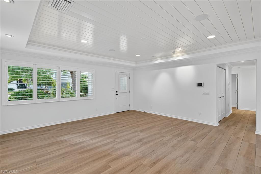 1135 7th Street South Naples, FL 34102 - Photo 11 of 35 a view of empty room with wooden floor
