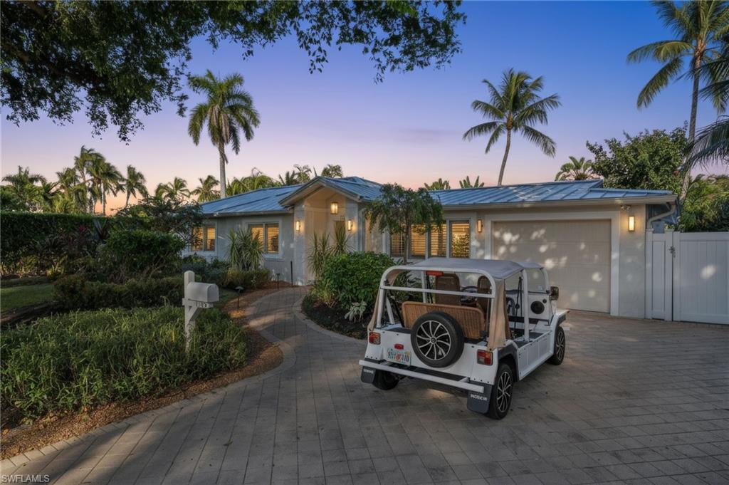 1135 7th Street South Naples, FL 34102 - Photo 2 of 35 a car parked in front of house