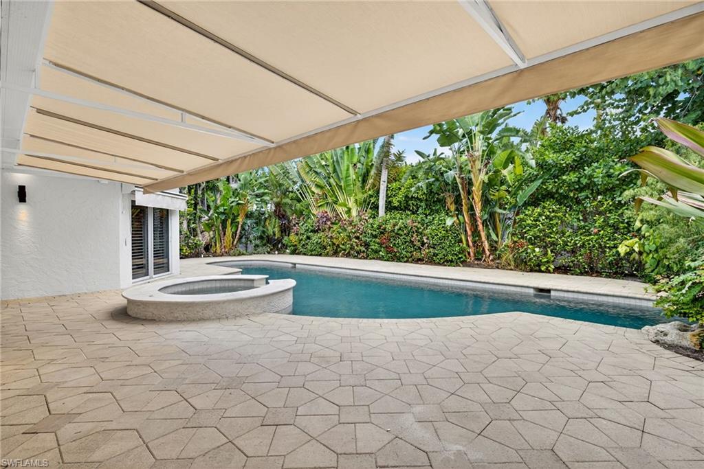 1135 7th Street South Naples, FL 34102 - Photo 29 of 35 a view of outdoor space and yard