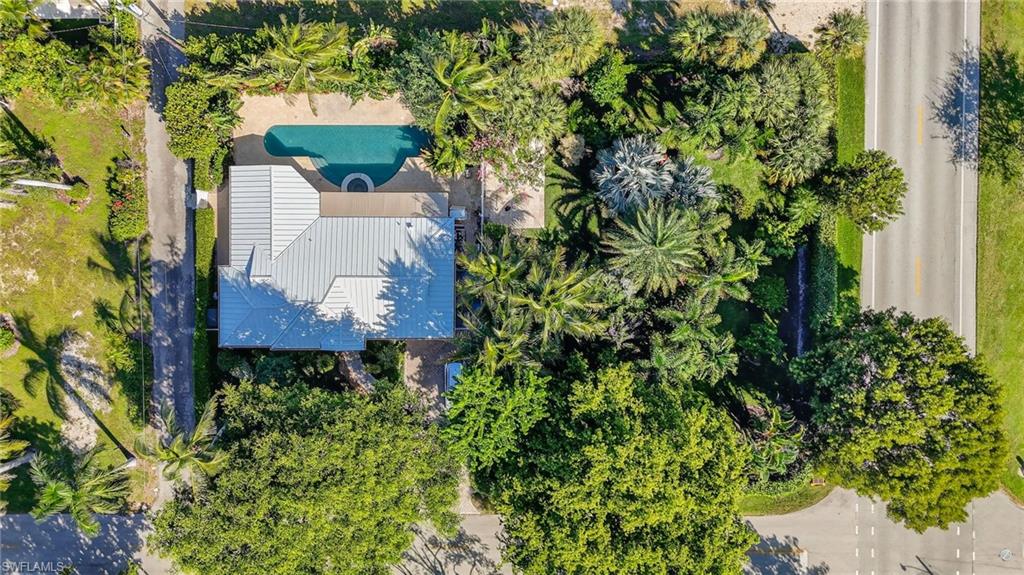 1135 7th Street South Naples, FL 34102 - Photo 34 of 35 an aerial view of a house with a yard and garden