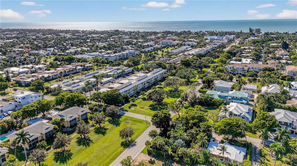 1135 7th Street South Naples, FL 34102 - Photo 5 of 35 an aerial view of a city with lots of residential buildings
