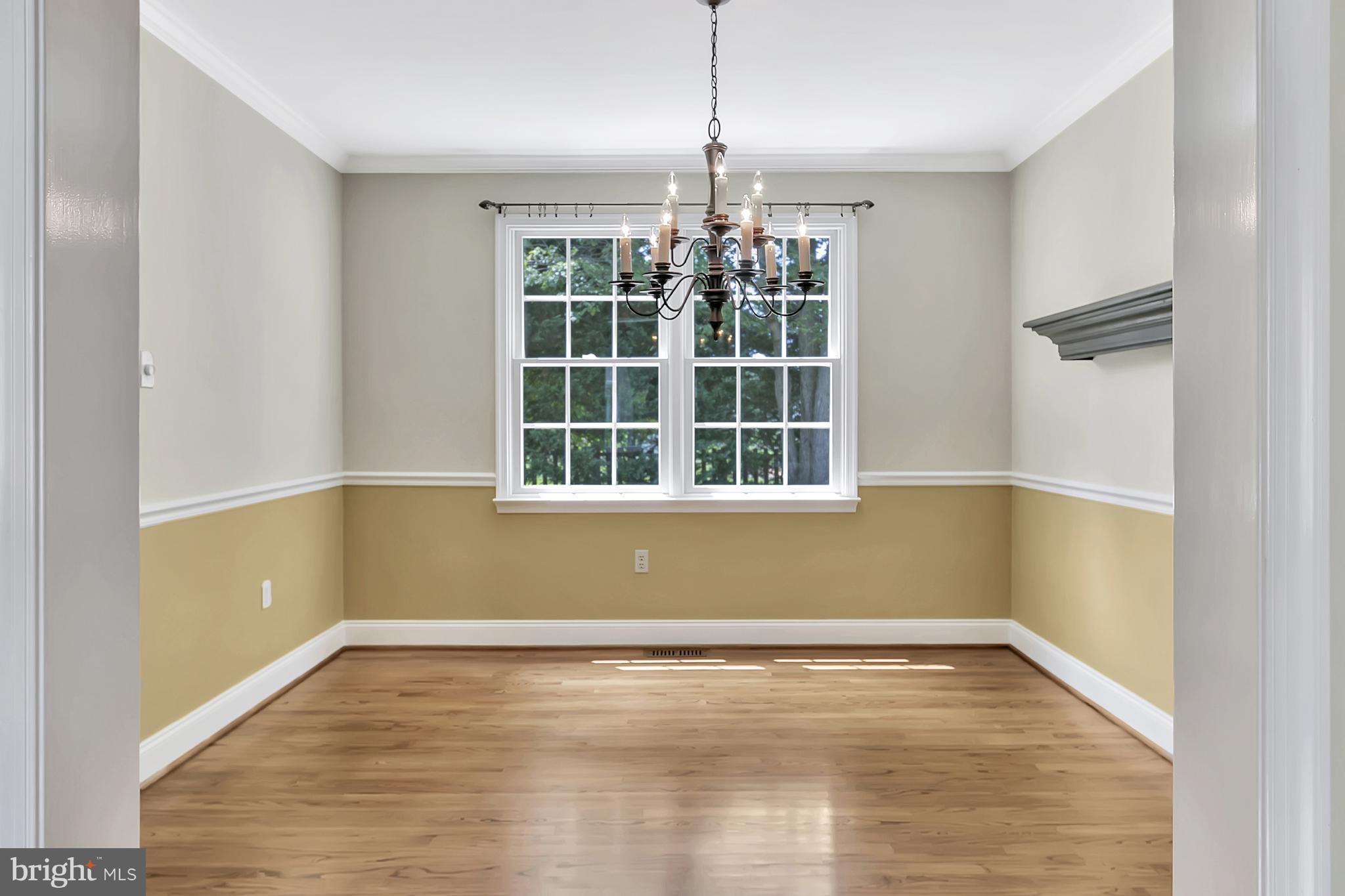 10 New Haven Drive Newark, DE 19713 - Photo 13 of 27 a view of empty room with wooden floor and fan