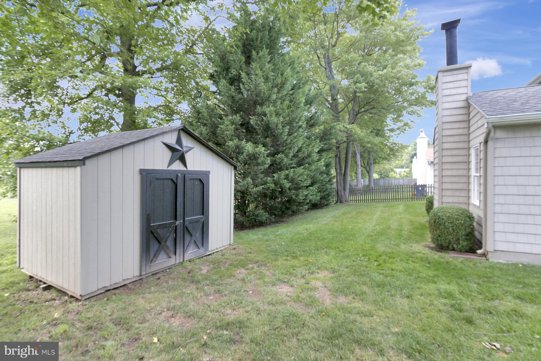 10 New Haven Drive Newark, DE 19713 - Photo 6 of 27 a backyard of a house with table and chairs
