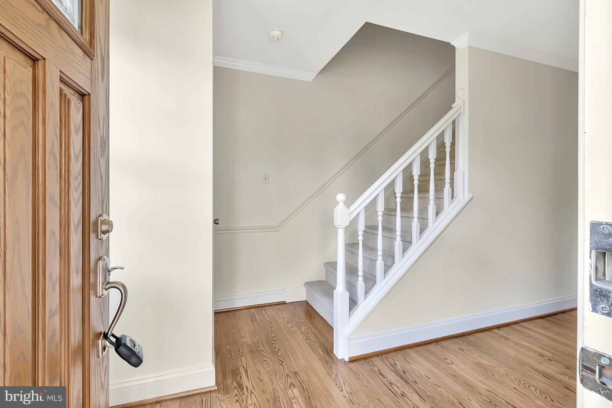 10 New Haven Drive Newark, DE 19713 - Photo 7 of 27 a view of a hallway with wooden floor and staircase