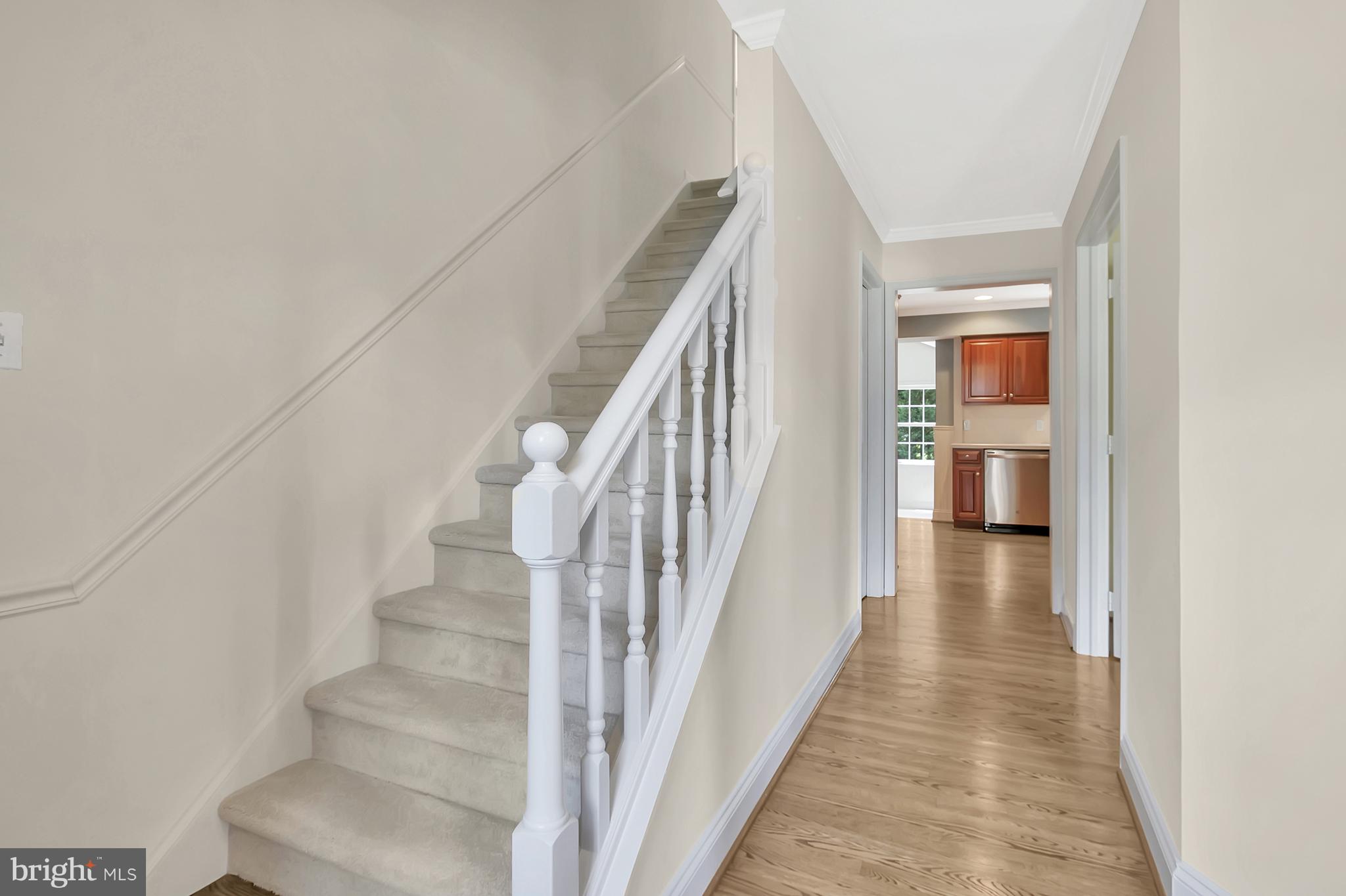 10 New Haven Drive Newark, DE 19713 - Photo 8 of 27 a view of a hallway with wooden floor and staircase