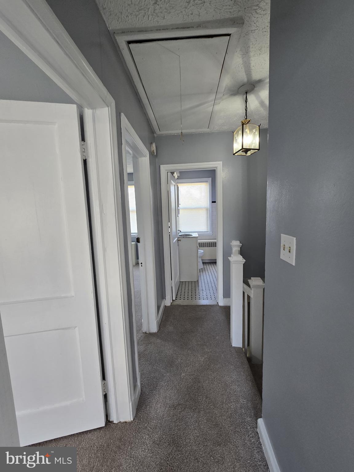 6105 Frederick Road Catonsville, MD 21228 - Photo 18 of 38 a view of a hallway with a livingroom and stairs