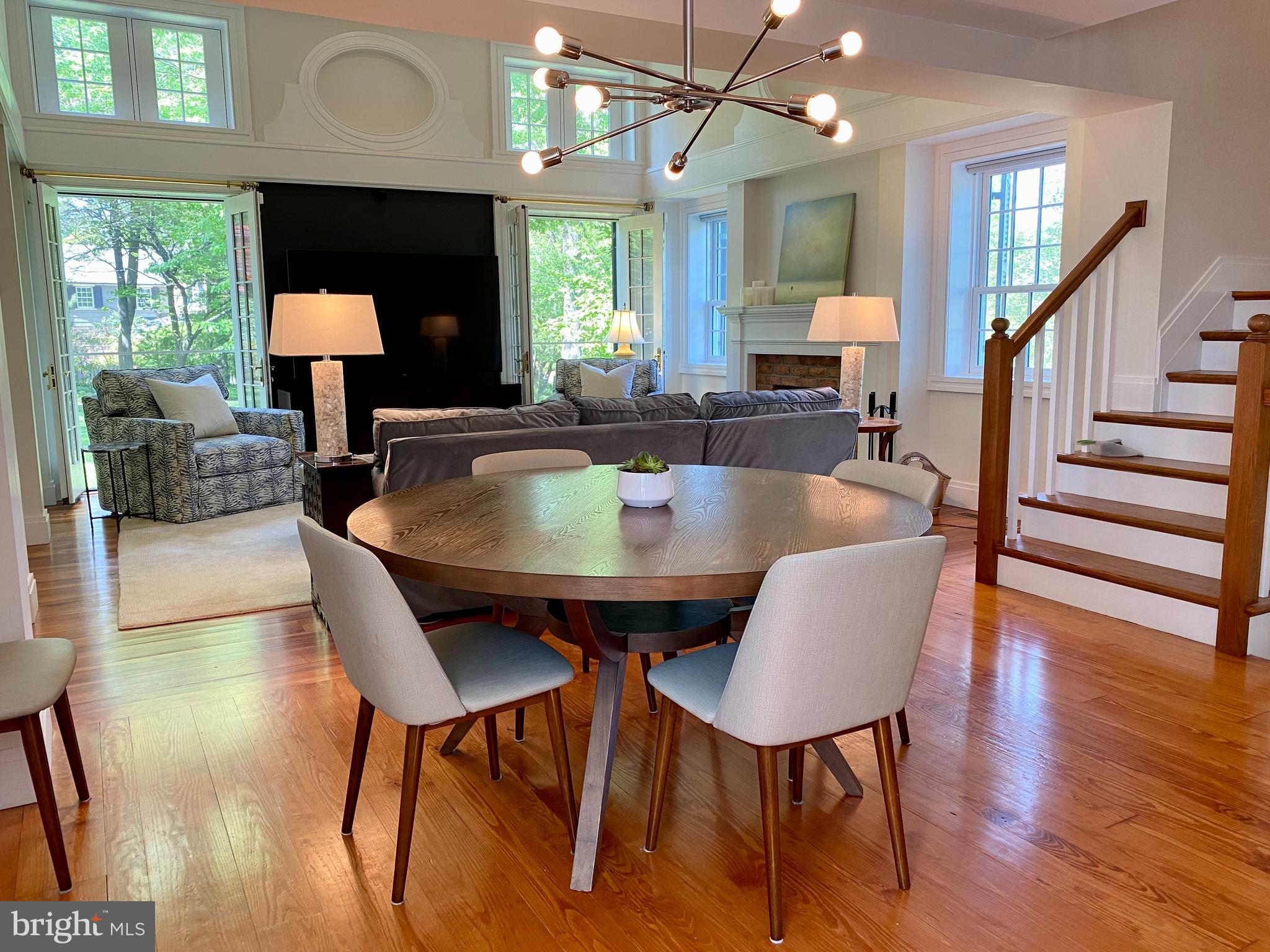 121 Upnor Road Baltimore, MD 21212 - Photo 27 of 79 a dining room with furniture a mirror and wooden floor