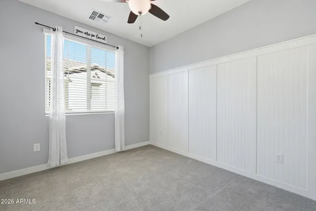 an empty room with a empty space and windows