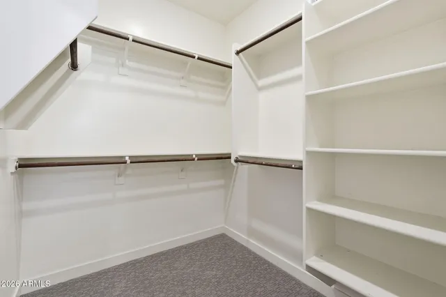 a view of an empty walk in closet