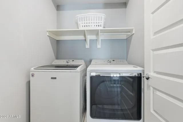 a utility room with dryer and washer