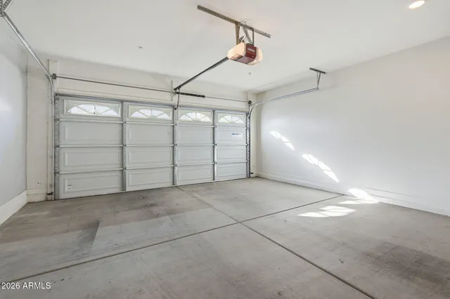 a view of an empty room with shelves and a fireplace