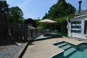 428 Putnam Hill Road Sutton, MA 01590 - Photo 15 of 42 a view of a backyard with sitting area