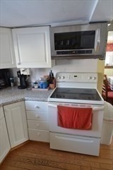 428 Putnam Hill Road Sutton, MA 01590 - Photo 19 of 42 a kitchen with a stove and a microwave