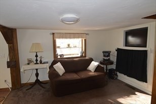 428 Putnam Hill Road Sutton, MA 01590 - Photo 24 of 42 a living room with furniture and a flat screen tv