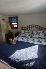 428 Putnam Hill Road Sutton, MA 01590 - Photo 27 of 42 a living room with rug