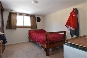 428 Putnam Hill Road Sutton, MA 01590 - Photo 28 of 42 a bedroom with a bed and a window