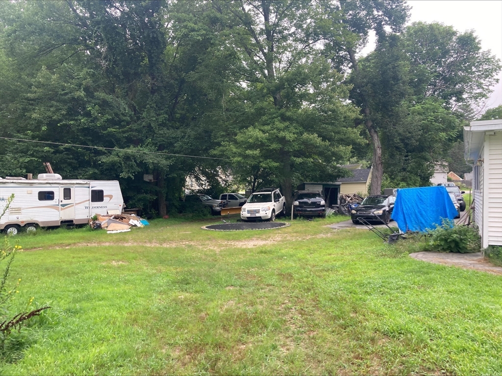 428 Putnam Hill Road Sutton, MA 01590 - Photo 35 of 42 a car parked in the middle of a field