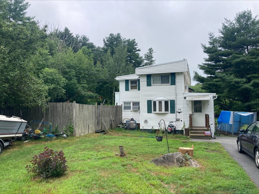 428 Putnam Hill Road Sutton, MA 01590 - Photo 36 of 42 a view of a house with backyard and sitting area