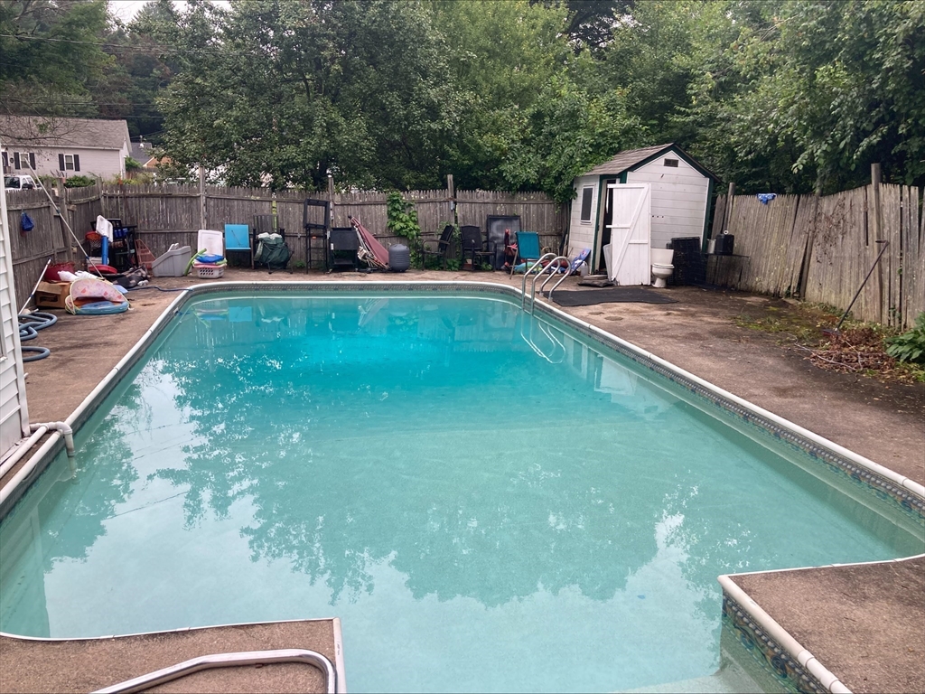 428 Putnam Hill Road Sutton, MA 01590 - Photo 41 of 42 a swimming pool view with a outdoor seating