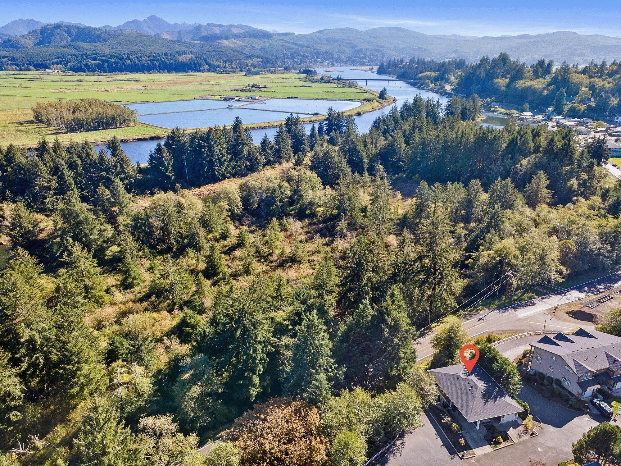 13150 D Street Nehalem, OR 97131 - Photo 28 of 29 an aerial view of a house with a lake view