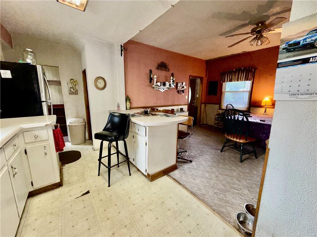 558 Whispering Pines Road Cairnbrook, PA 15924 - Photo 12 of 44 a room with furniture a rug and white walls