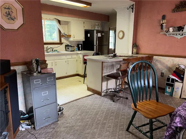 a view of a kitchen and dining room