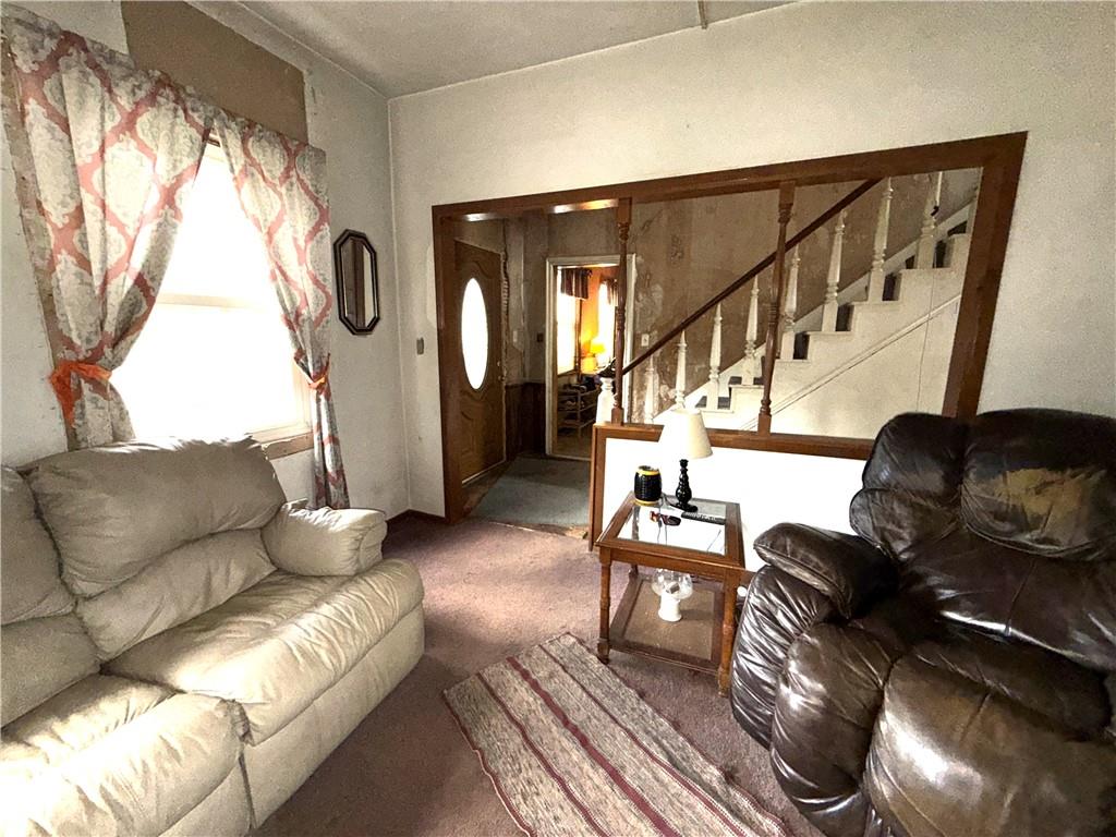 558 Whispering Pines Road Cairnbrook, PA 15924 - Photo 16 of 44 a living room with furniture and a fireplace