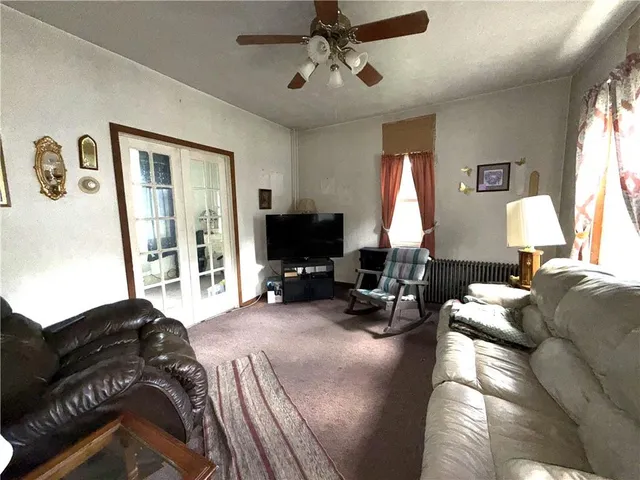 a living room with furniture fireplace and a flat screen tv