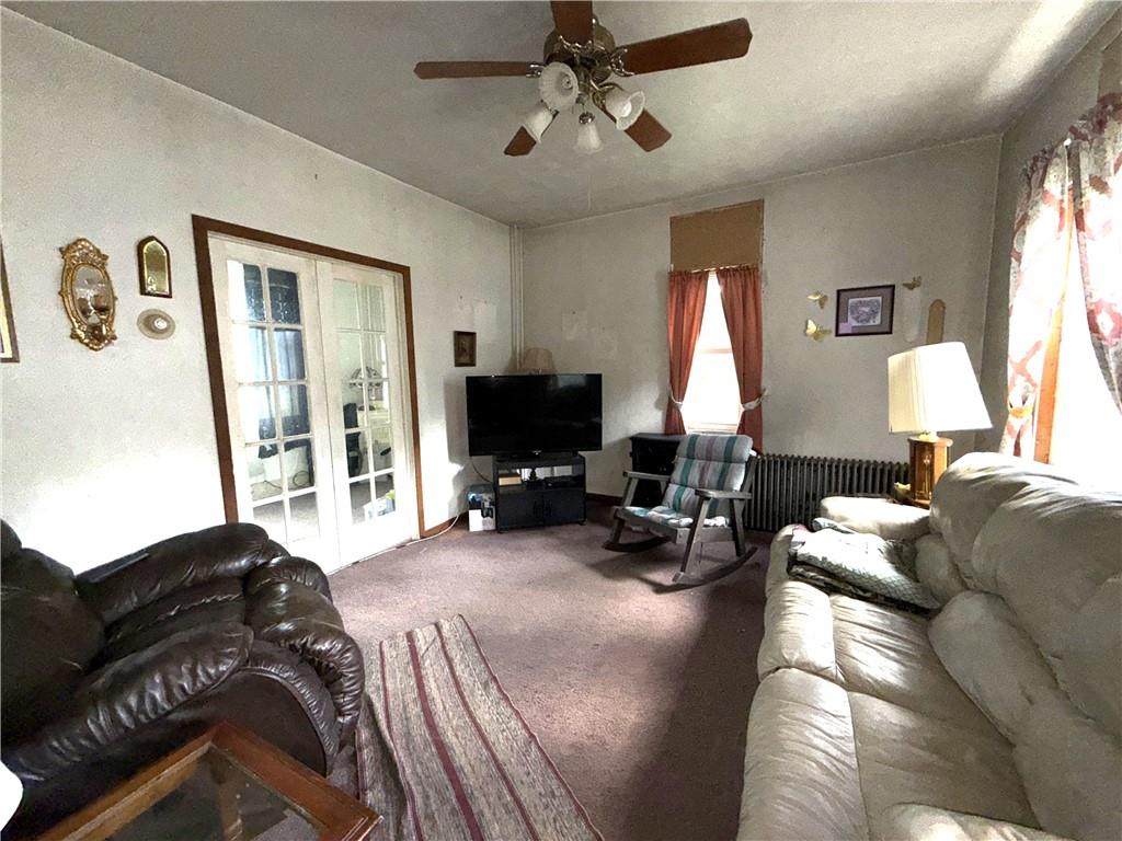 558 Whispering Pines Road Cairnbrook, PA 15924 - Photo 17 of 44 a living room with furniture fireplace and a flat screen tv