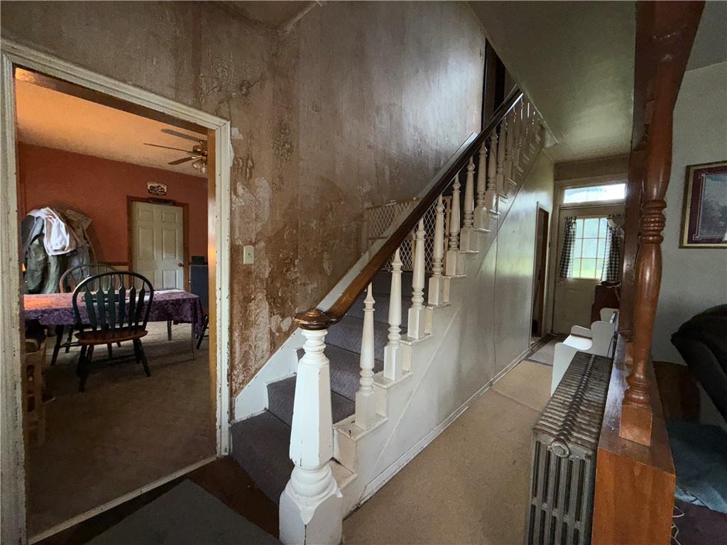 558 Whispering Pines Road Cairnbrook, PA 15924 - Photo 19 of 44 a living room with furniture and a chandelier