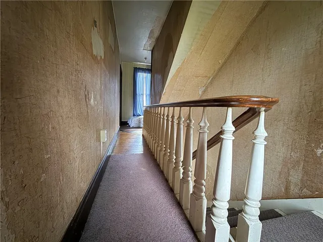 a view of a stairs and an entryway