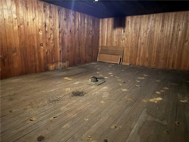 a view of small space with wooden walls