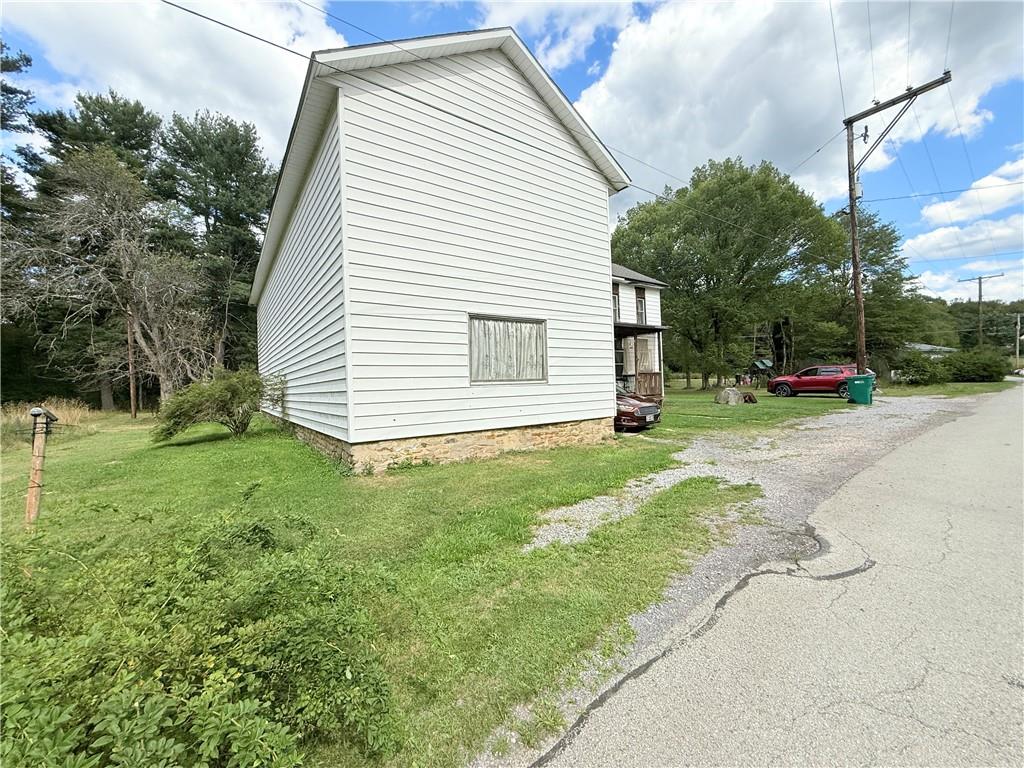 558 Whispering Pines Road Cairnbrook, PA 15924 - Photo 4 of 44 a view of a house with a backyard