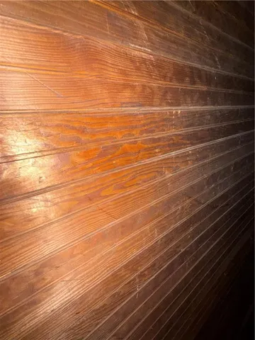 a view of a yard with a house in the background