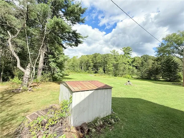 a view of a yard with an outdoor space
