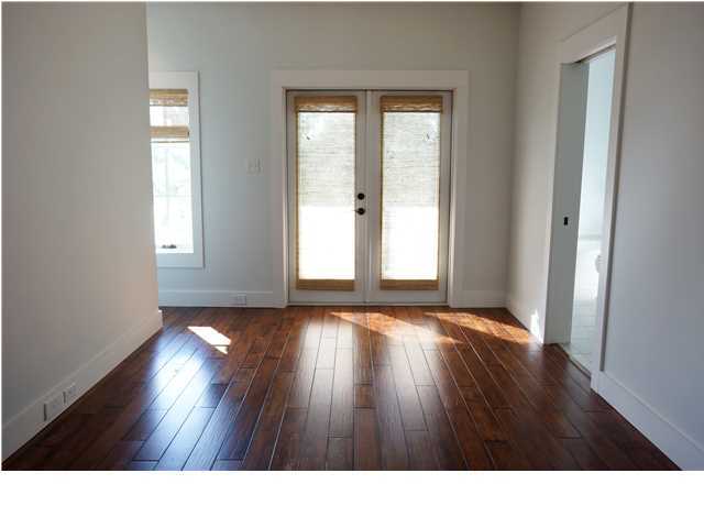 128 Marlin Street Santa Rosa Beach, FL 32459 - Photo 12 of 21 a bathroom with a window and wooden floor