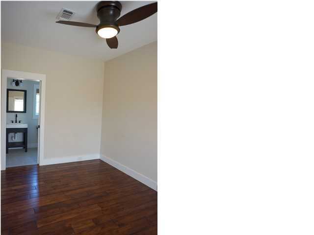 128 Marlin Street Santa Rosa Beach, FL 32459 - Photo 17 of 21 a view of an empty room with wooden floor