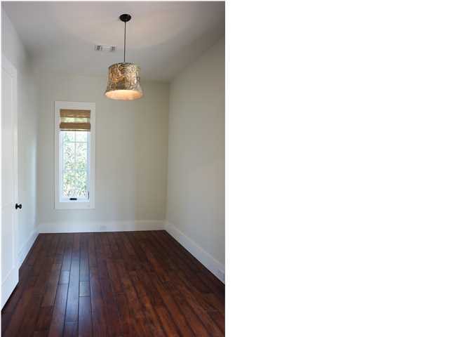 128 Marlin Street Santa Rosa Beach, FL 32459 - Photo 9 of 21 a picture of a room with a window and wooden floor