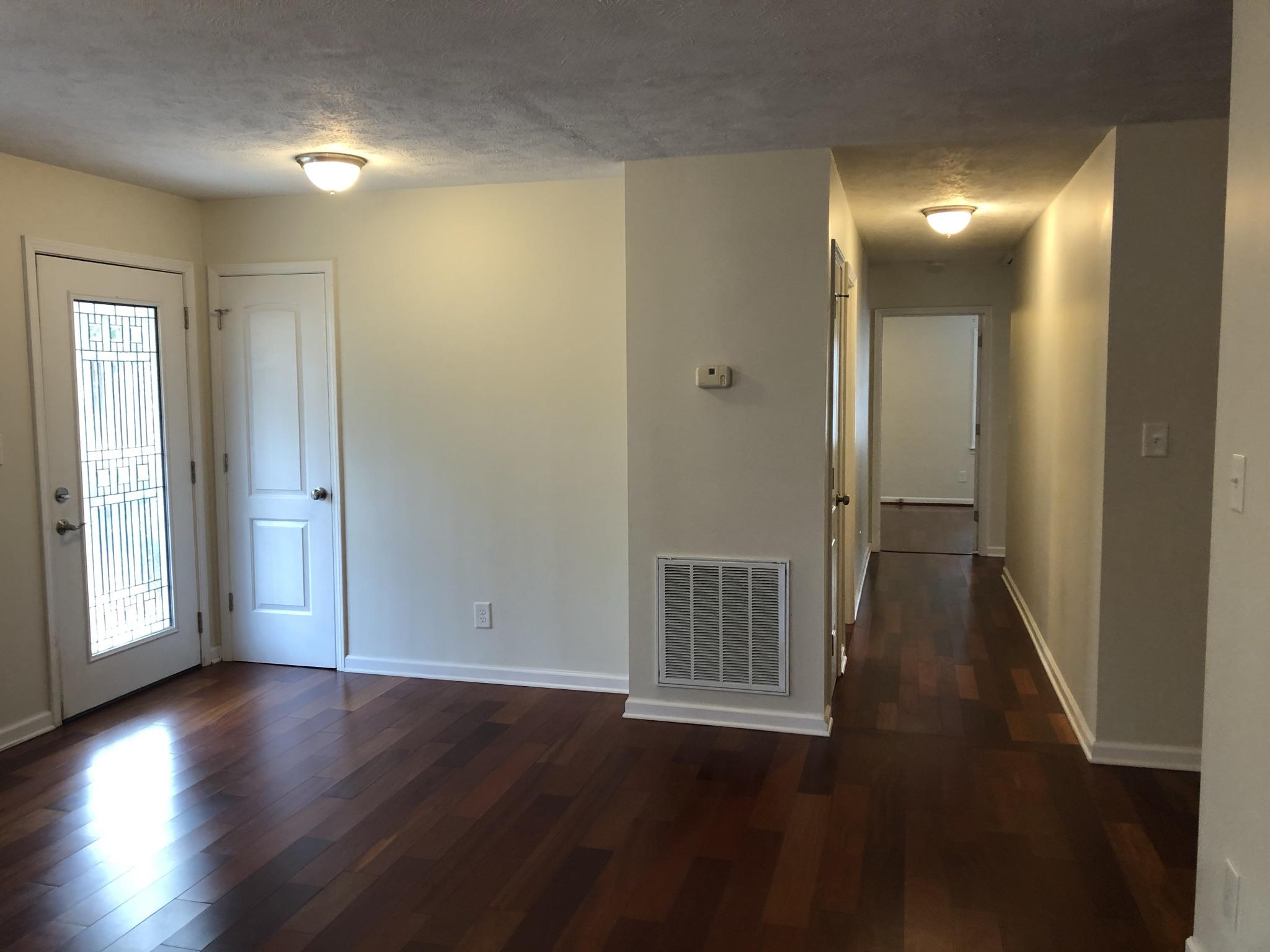 905 Robinwood Road Aberdeen, NC 28315 - Photo 18 of 42 beautiful floors continue down the hallway. Cost closet by the front door.