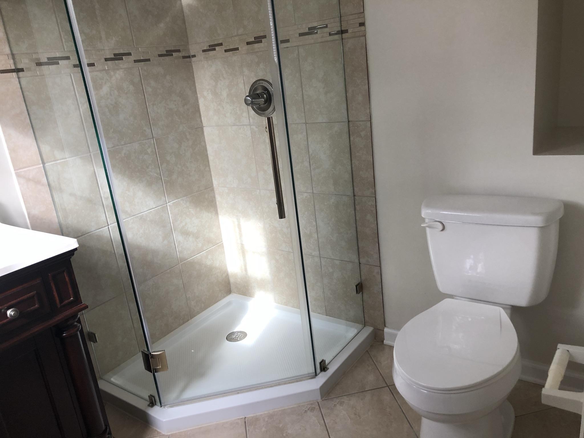 905 Robinwood Road Aberdeen, NC 28315 - Photo 20 of 42 A convenient niche behind the toilet for towels and additional storage.