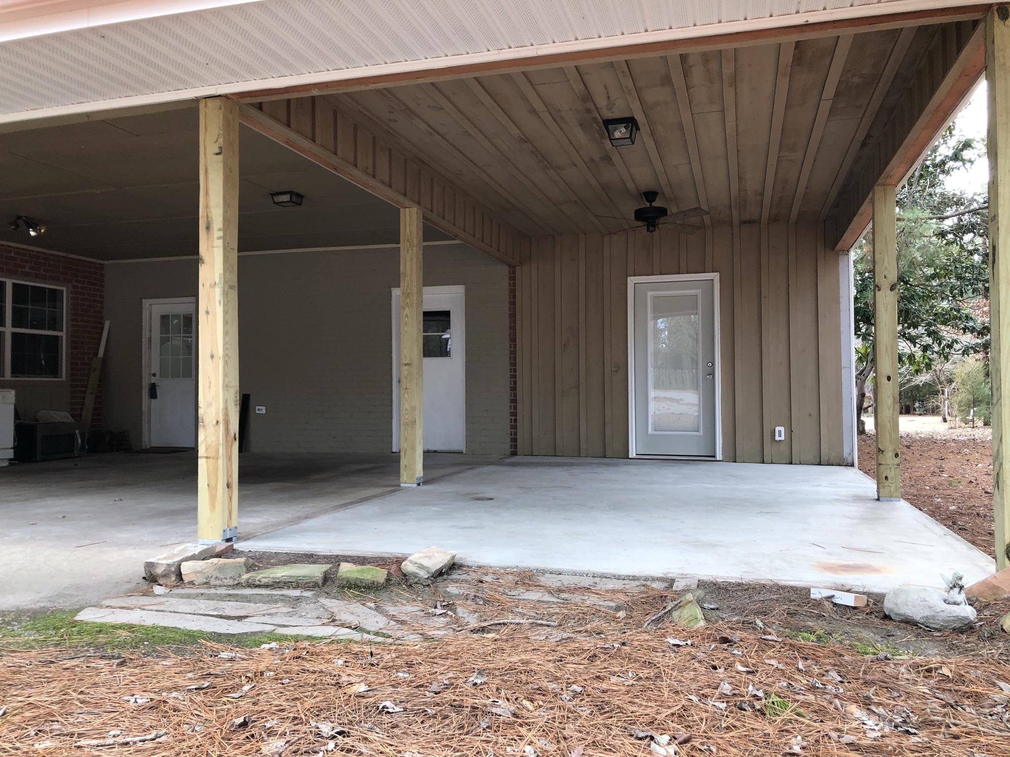 905 Robinwood Road Aberdeen, NC 28315 - Photo 24 of 42 Covered Patio outside of the apartment. Would make a great screened porch!