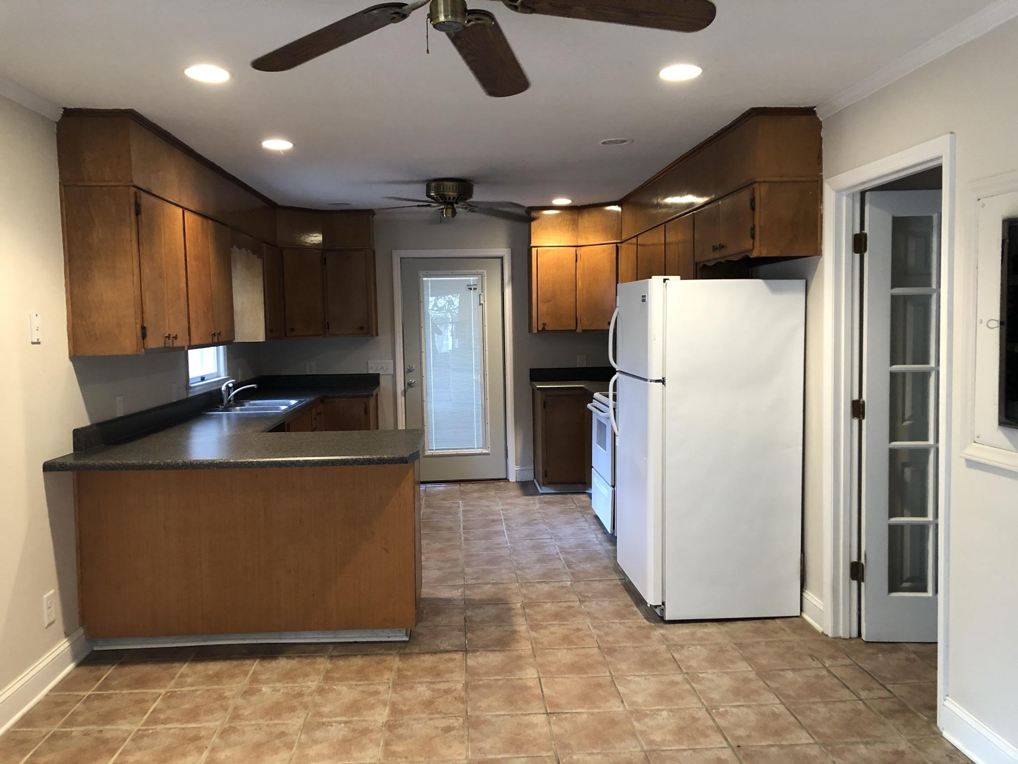 905 Robinwood Road Aberdeen, NC 28315 - Photo 27 of 42 Great use of space. compact kitchen with ample storage and breakfast bar