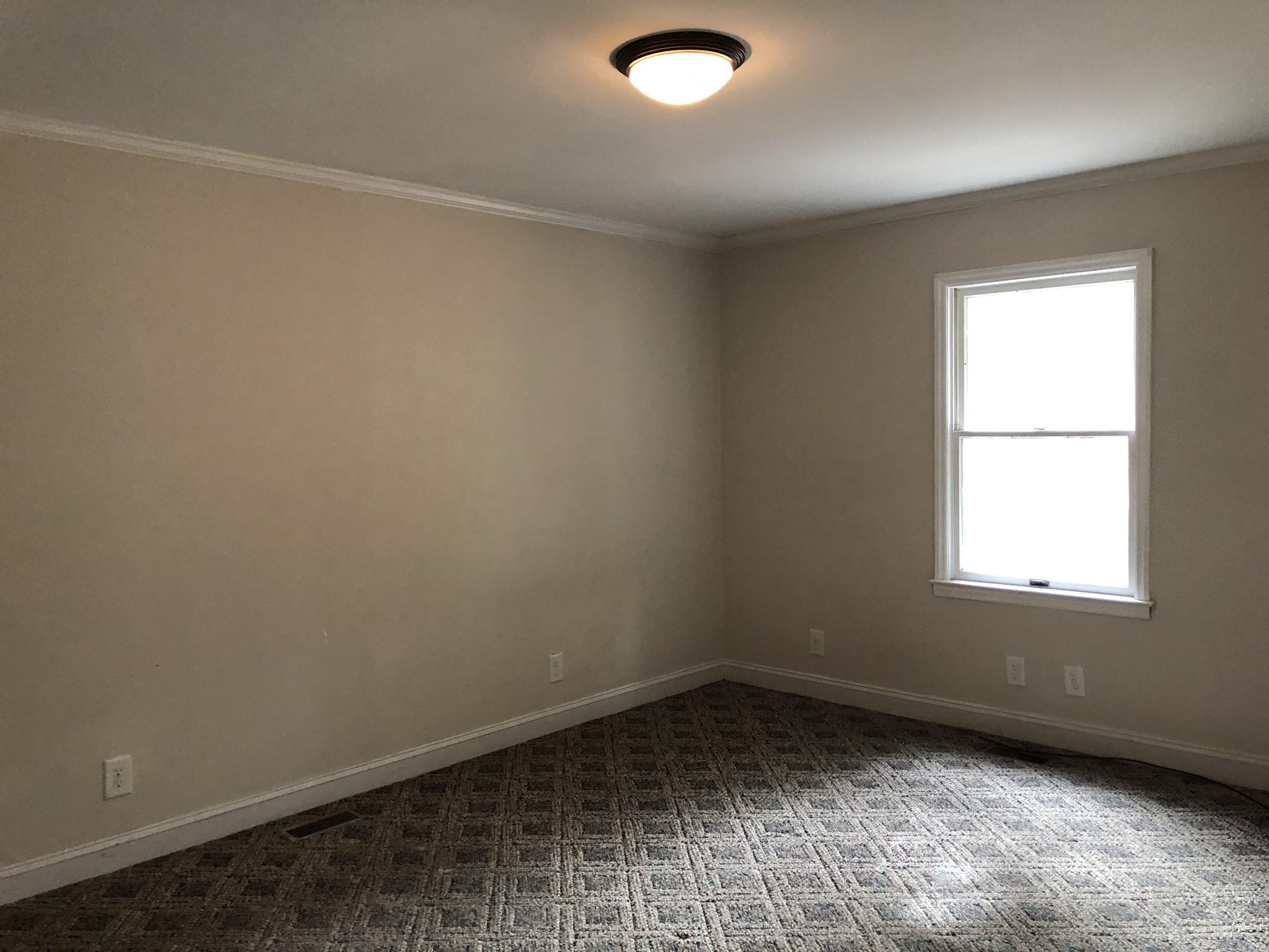 905 Robinwood Road Aberdeen, NC 28315 - Photo 29 of 42 Large and bright bedroom in the apartment. Could fit multiple beds!