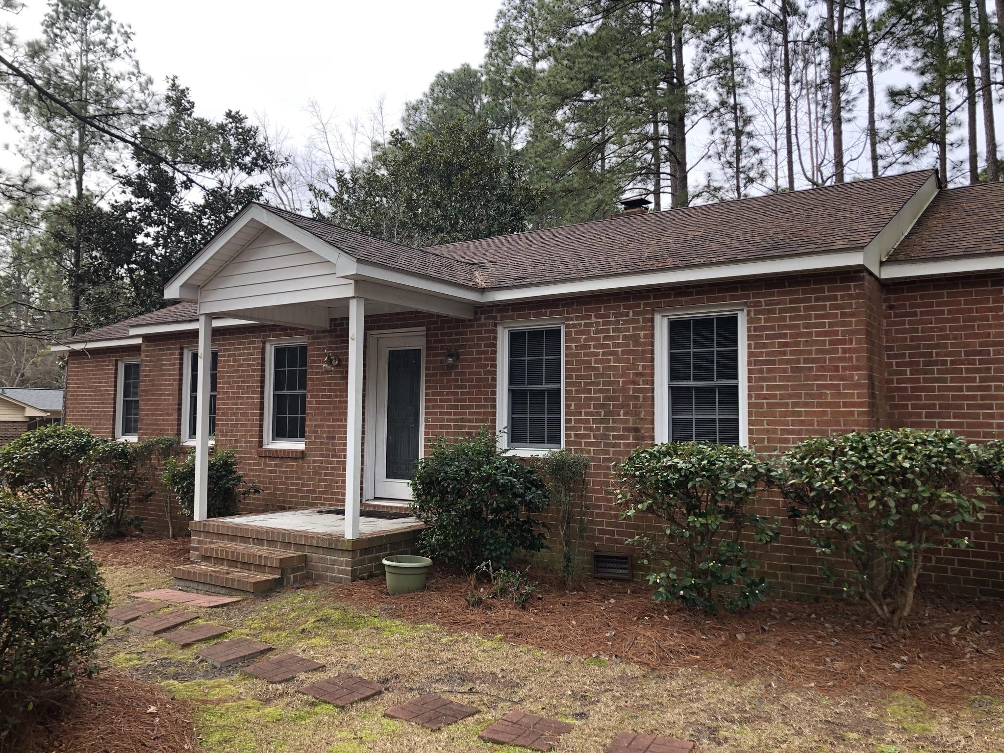 905 Robinwood Road Aberdeen, NC 28315 - Photo 3 of 42 existing foundation shrubs make a great backdrop for perinneal flowers