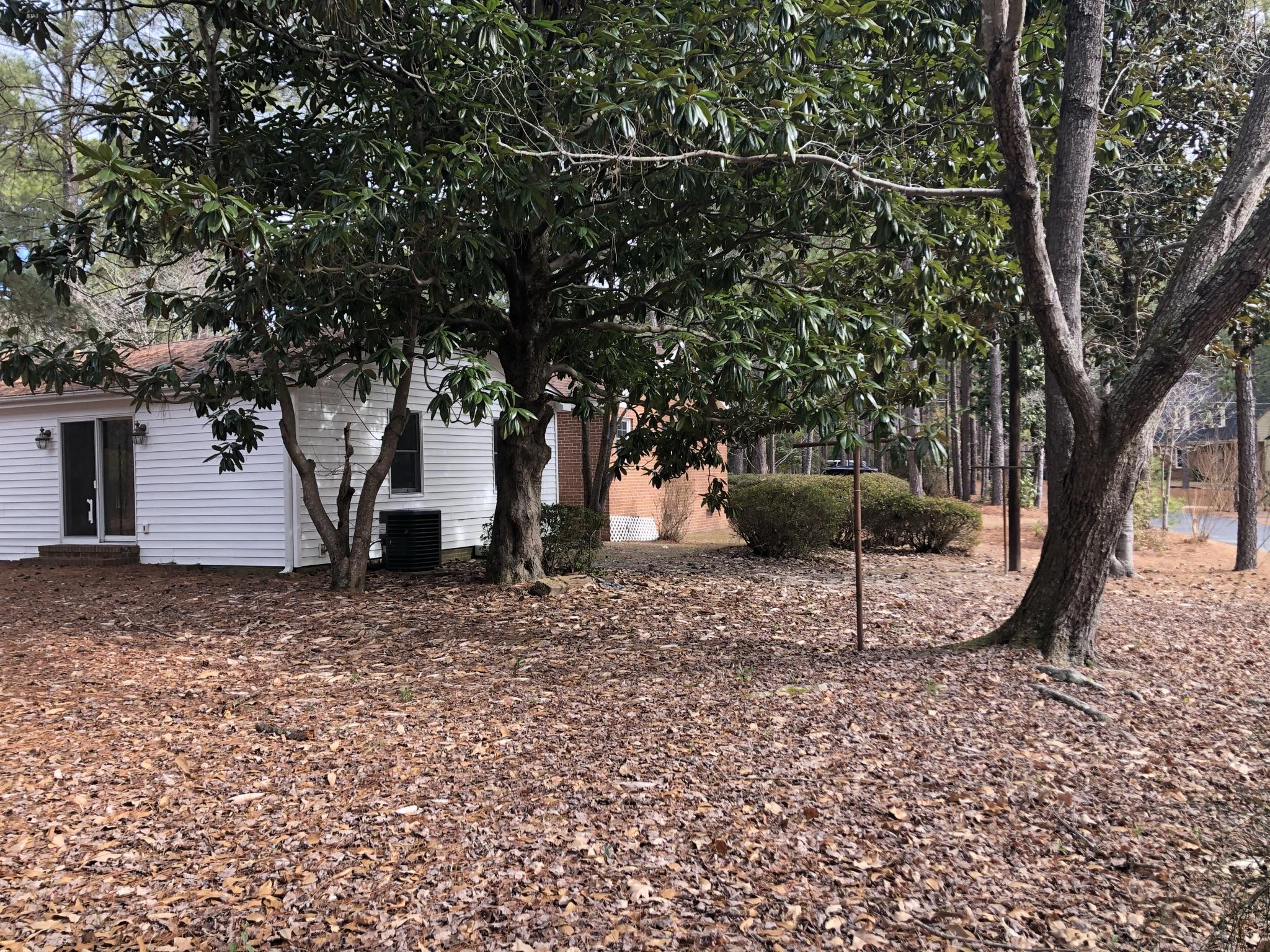 905 Robinwood Road Aberdeen, NC 28315 - Photo 34 of 42 Magnolia, azaleas, pines and other mature plantings