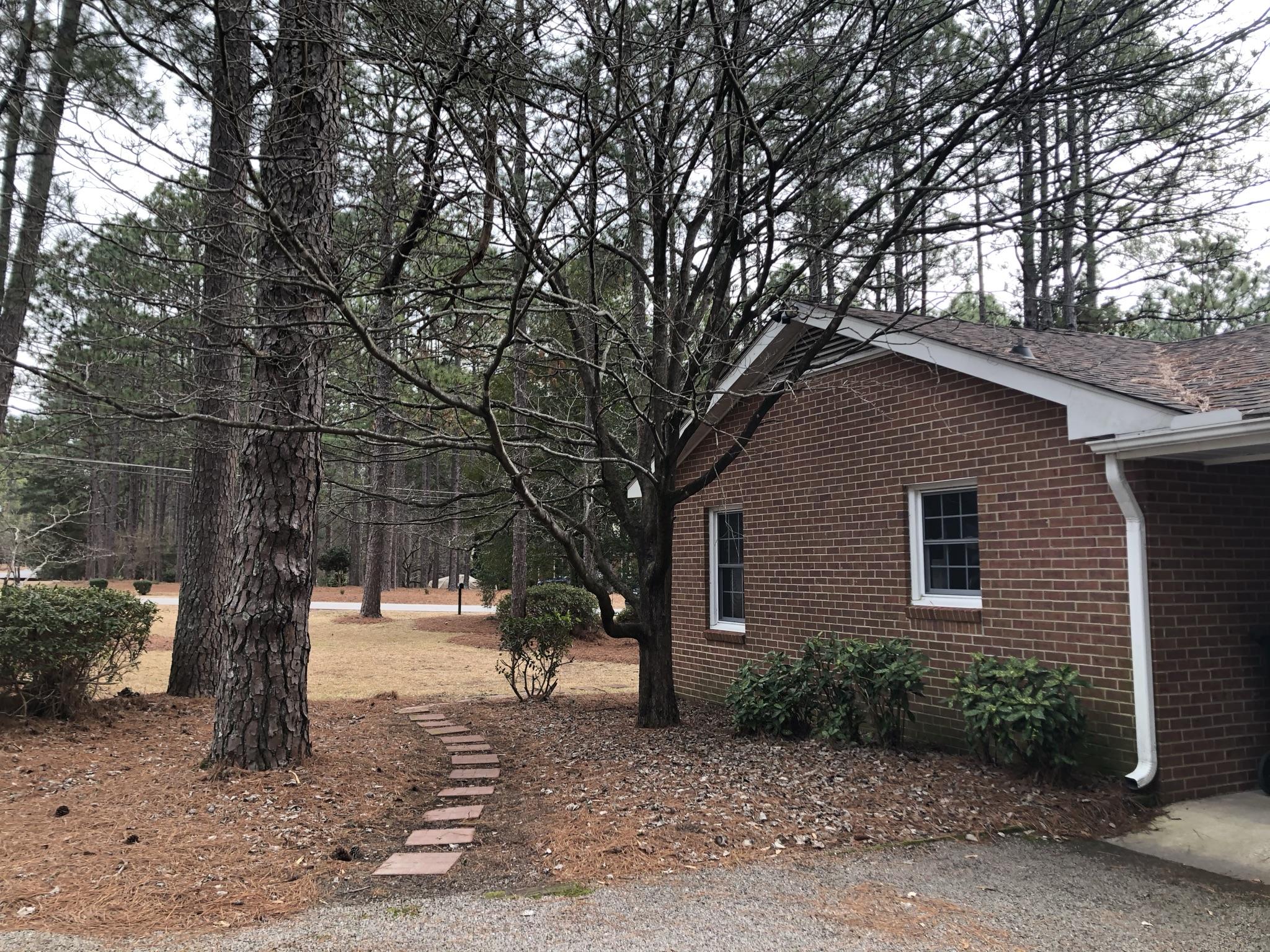 905 Robinwood Road Aberdeen, NC 28315 - Photo 36 of 42 stepping stone path from driveway. Lots of potential to build on exhisting landscaping