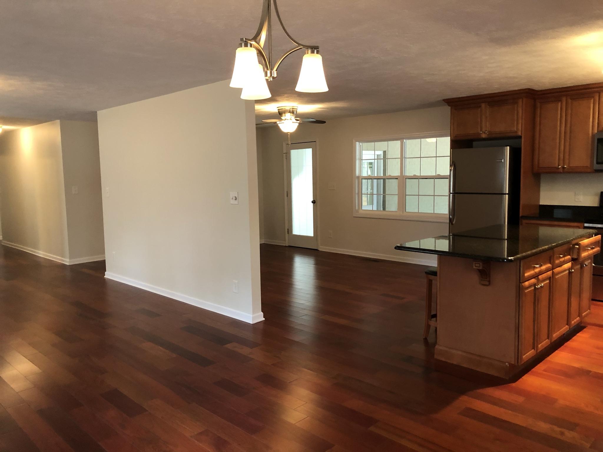 905 Robinwood Road Aberdeen, NC 28315 - Photo 42 of 42 open floor plan. dining area looking left into living room and kitchen and den on the right.