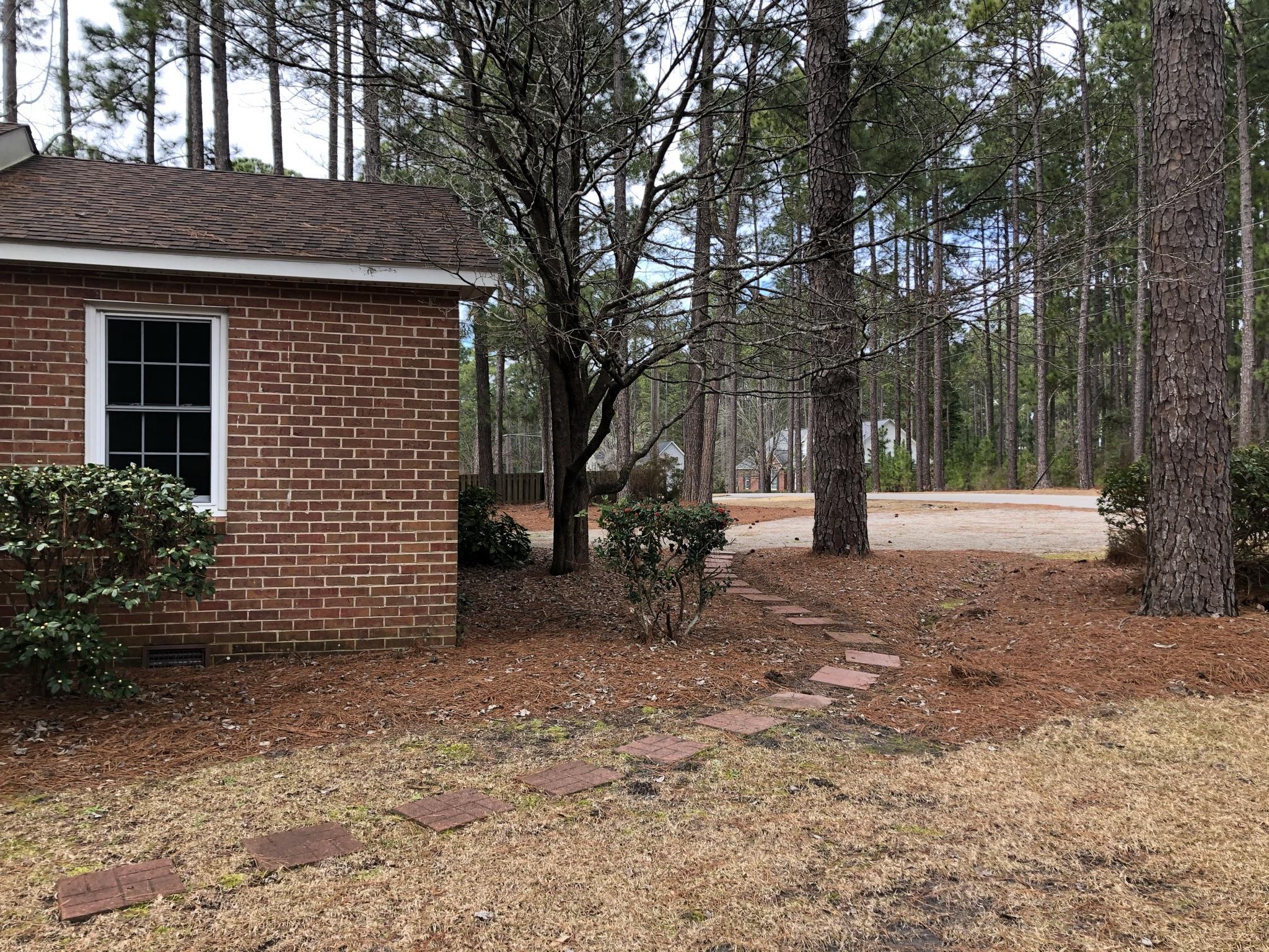 905 Robinwood Road Aberdeen, NC 28315 - Photo 4 of 42 stepping stone path from the driveway to the front door