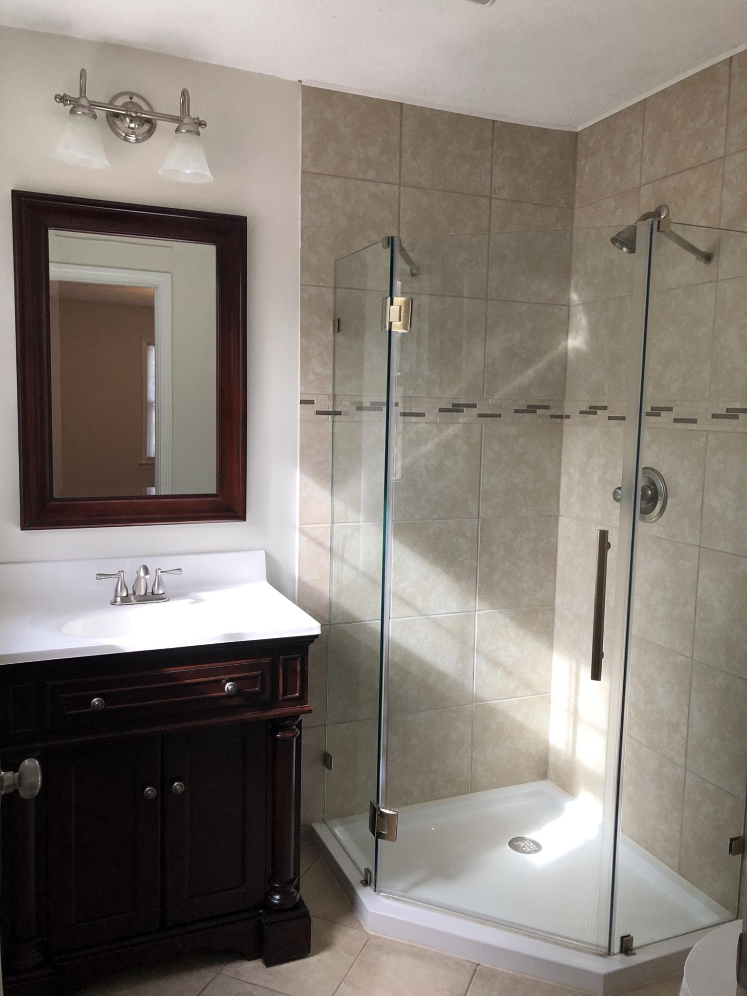 905 Robinwood Road Aberdeen, NC 28315 - Photo 5 of 42 master bath with tiled shower and frameless glass